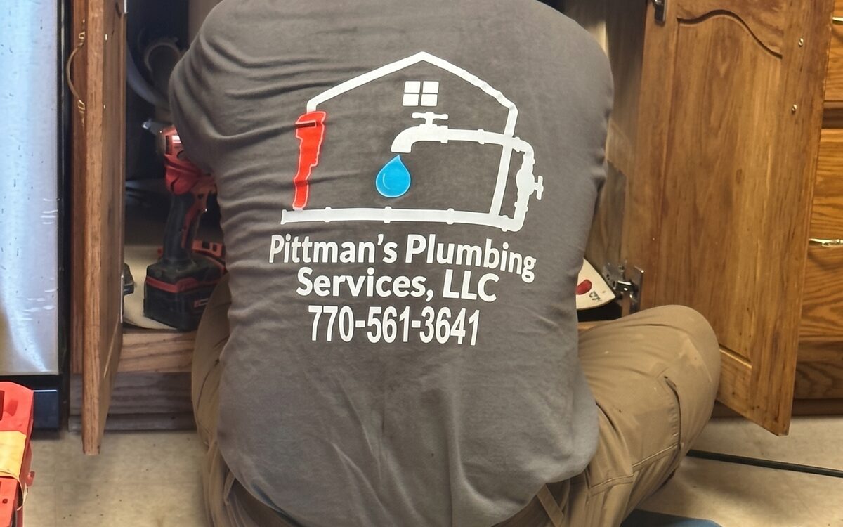 Under-sink plumbing repair in progress